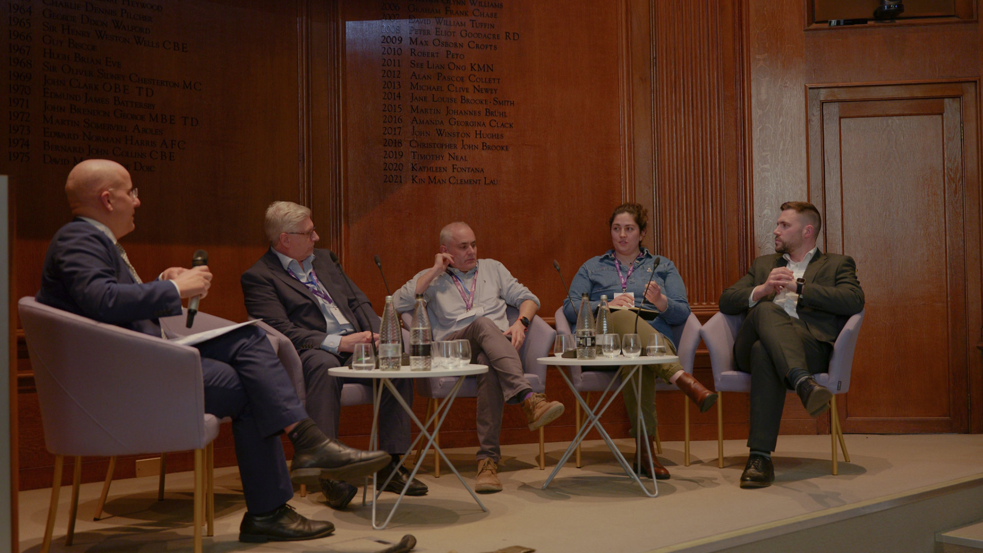The panel on stage at the RICS HQ for the Quality in Retrofit Summit
