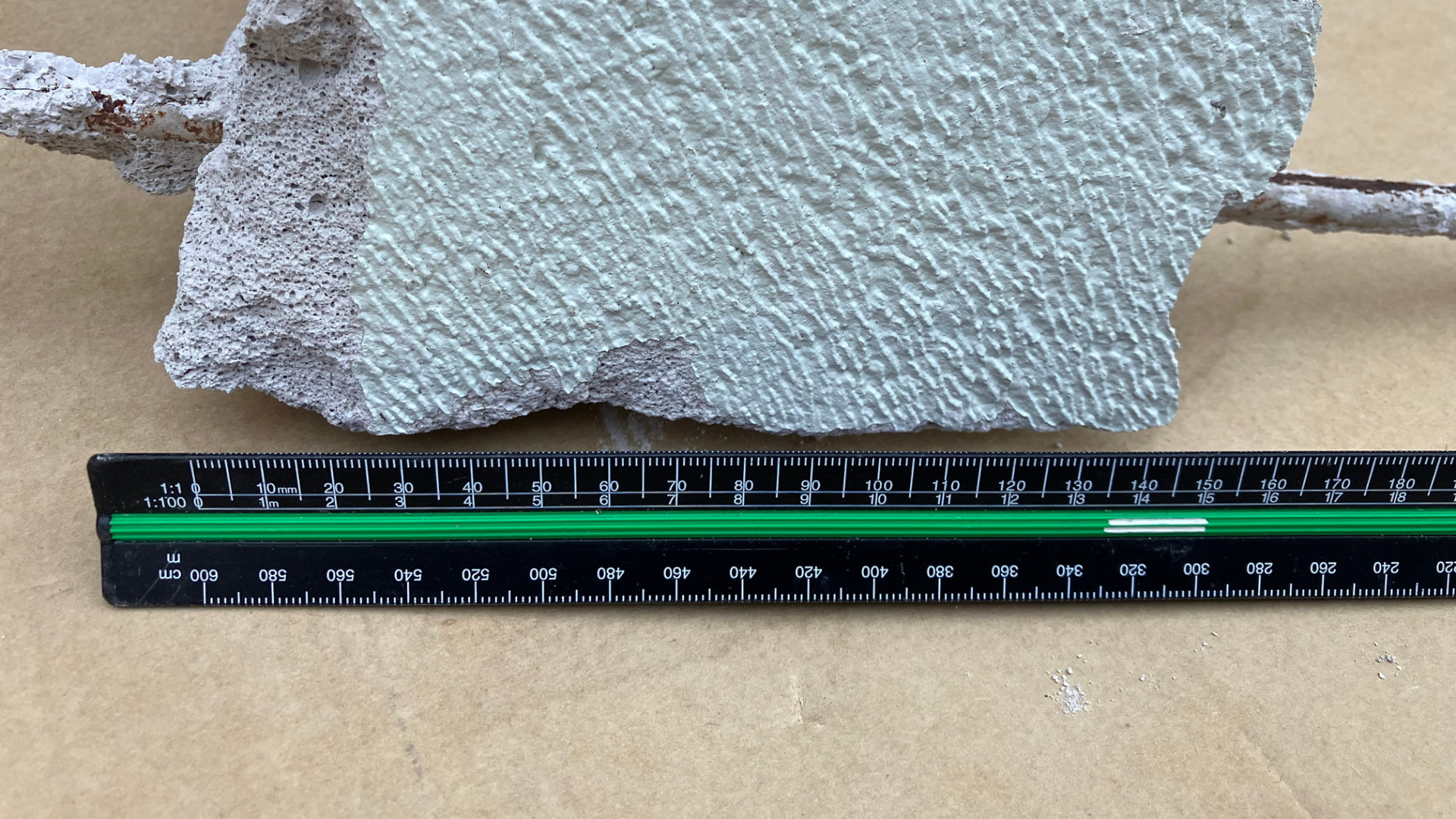 Close-up of a segment of RAAC with a ruler for scale