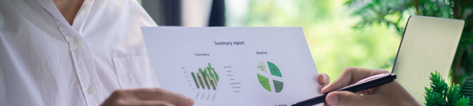 Hands working on sustainable charts