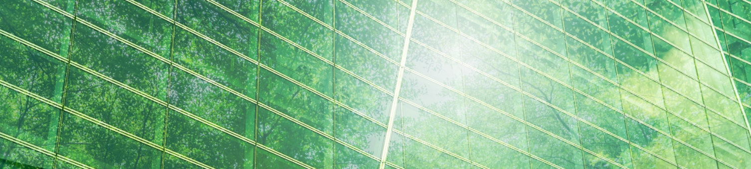 Sustainble green building. Eco-friendly building. Sustainable glass office building with tree for reducing carbon dioxide. Office with green environment. Corporate building reduce CO2. Safety glass.