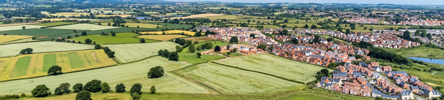 Fields and houses in Somerset, England, from a drone