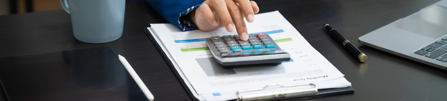 Young chinese business woman doing bookkeeping analyst audit working papers, public offering, cash budget, accrued dividend, note payable, actual cost, aging schedule, intangible fixed asset