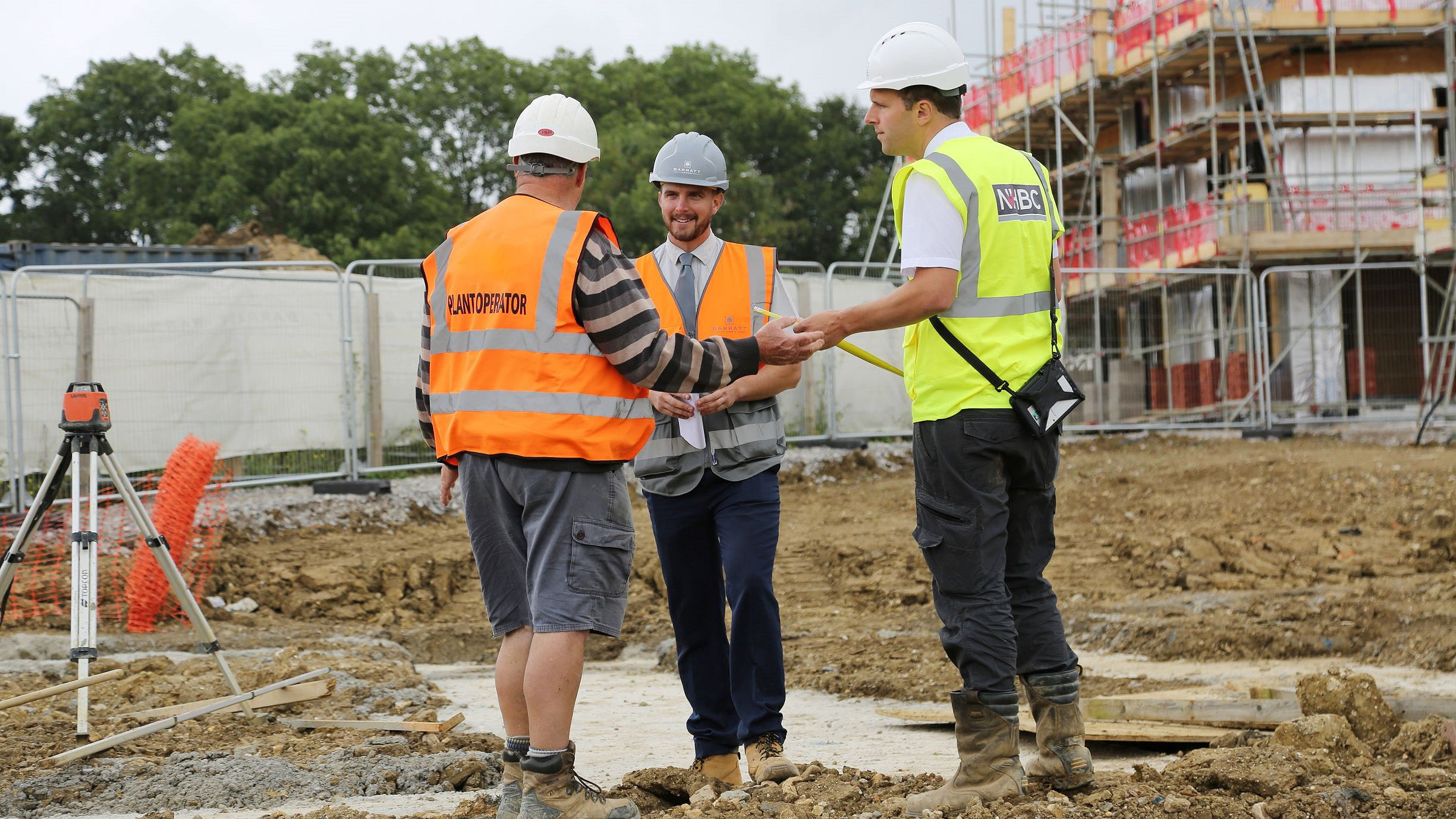 Three men on construction site