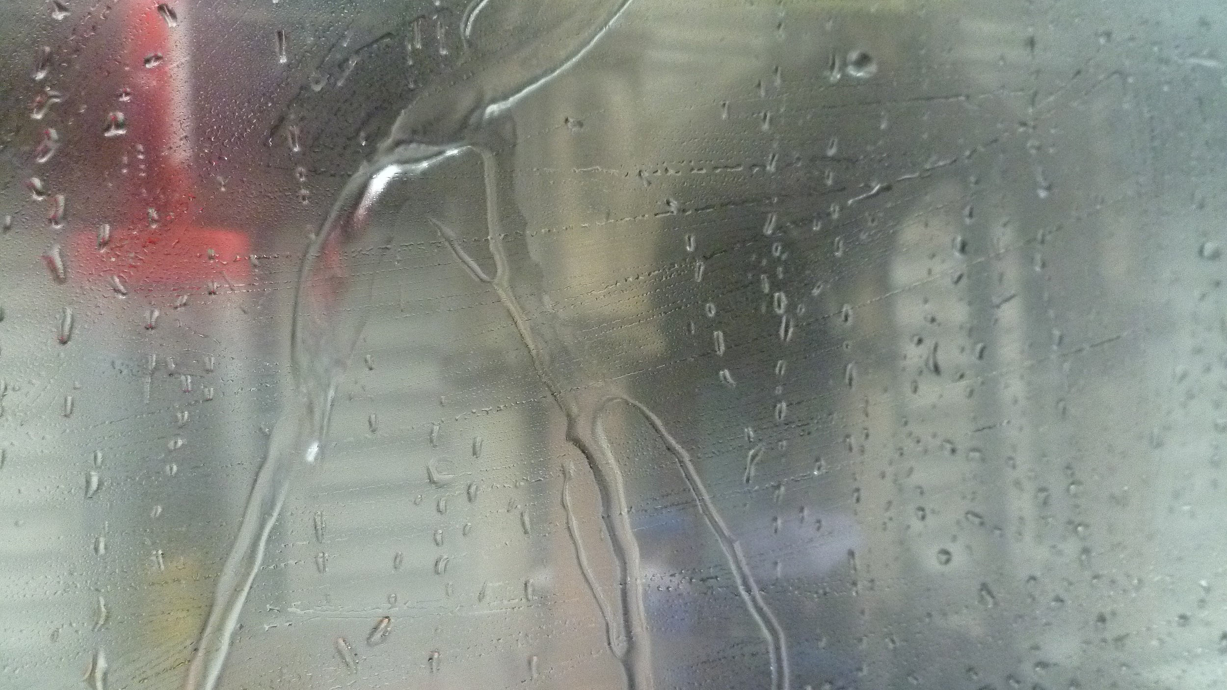 Rain running down glass