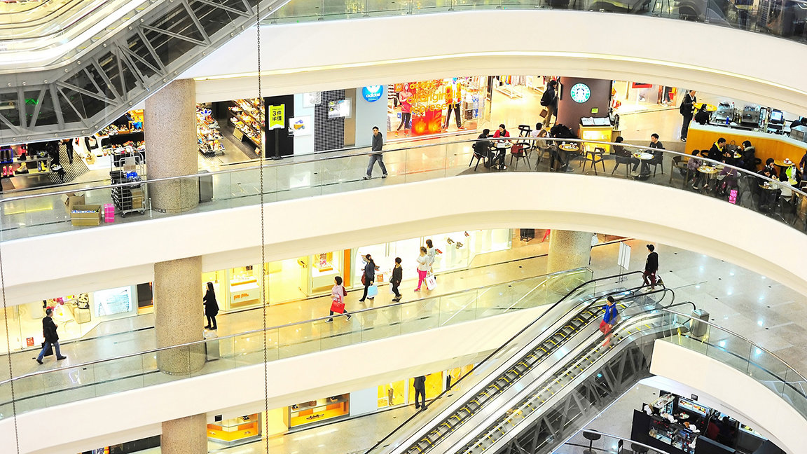 View of central atrium of a Hong Kong shopping mall on several levels