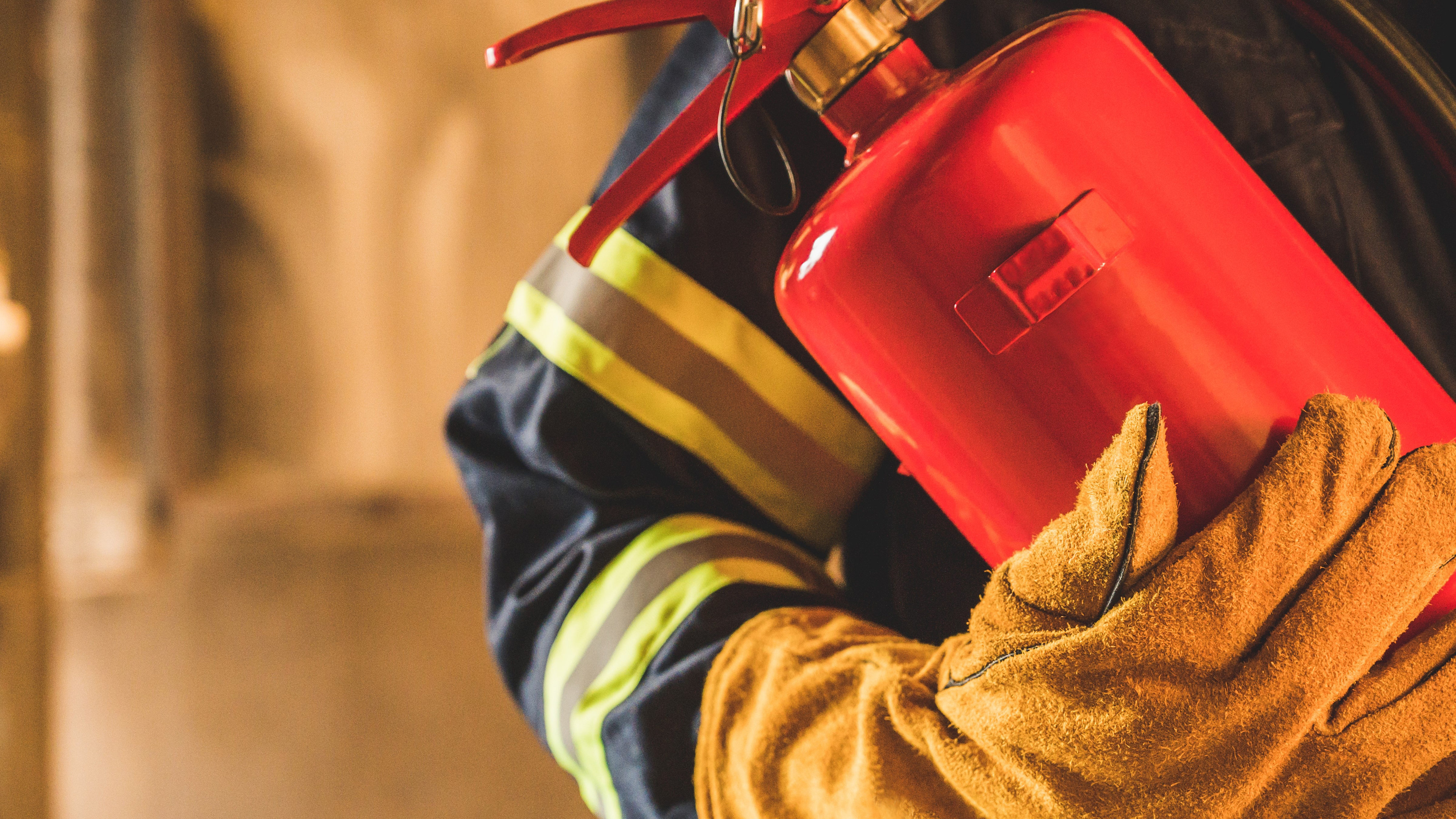 Figure holding fire extinguisher