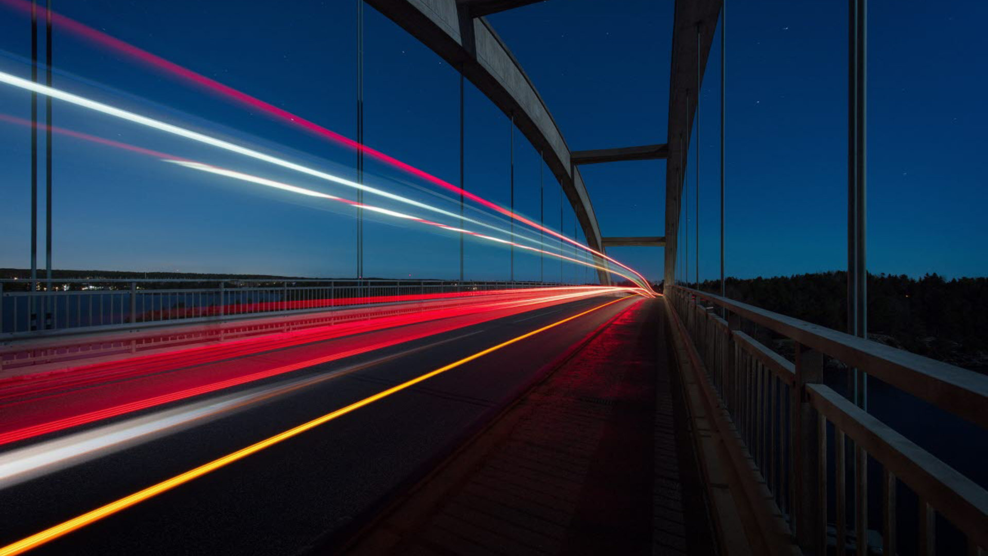 Time-lapse still of a bridge with cars