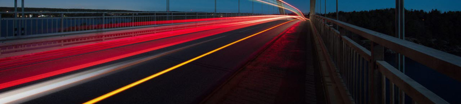 Time-lapse still of a bridge with cars