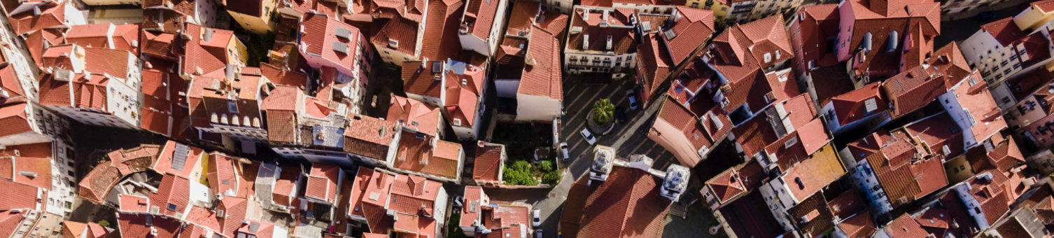 Beautiful bird eye view of Alfama district in Lisbon, Portugal. Aerial drone shot of the city centre of Lisbon during a sunny winter day. 