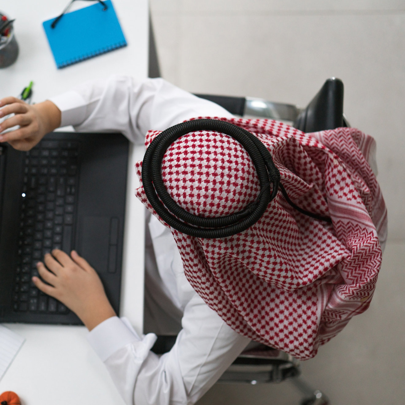 a young arab businessman working on laptop at the desk