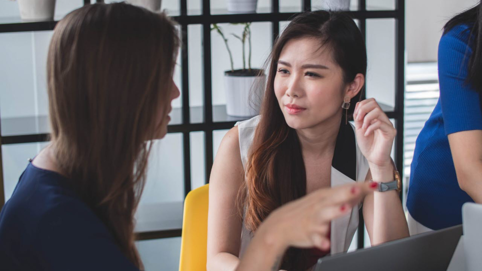 Two women talking at work