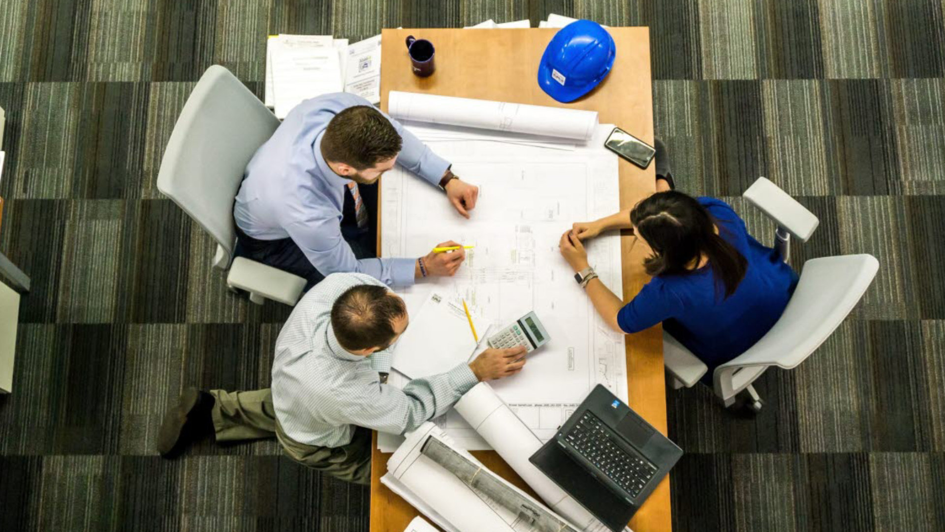 Group of people working on a construction project together