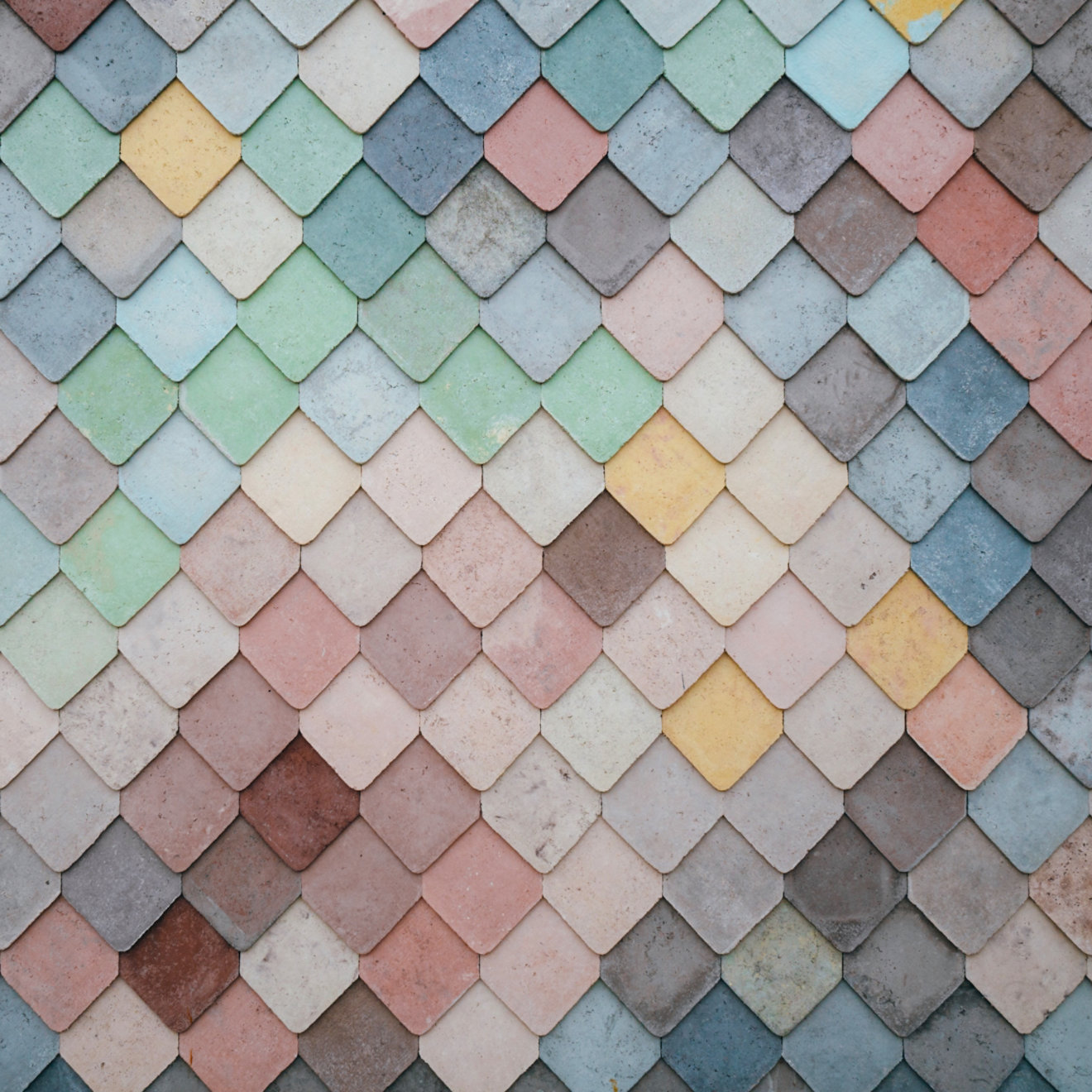 An abstract closeup of a diamond-patterned architectural feature.