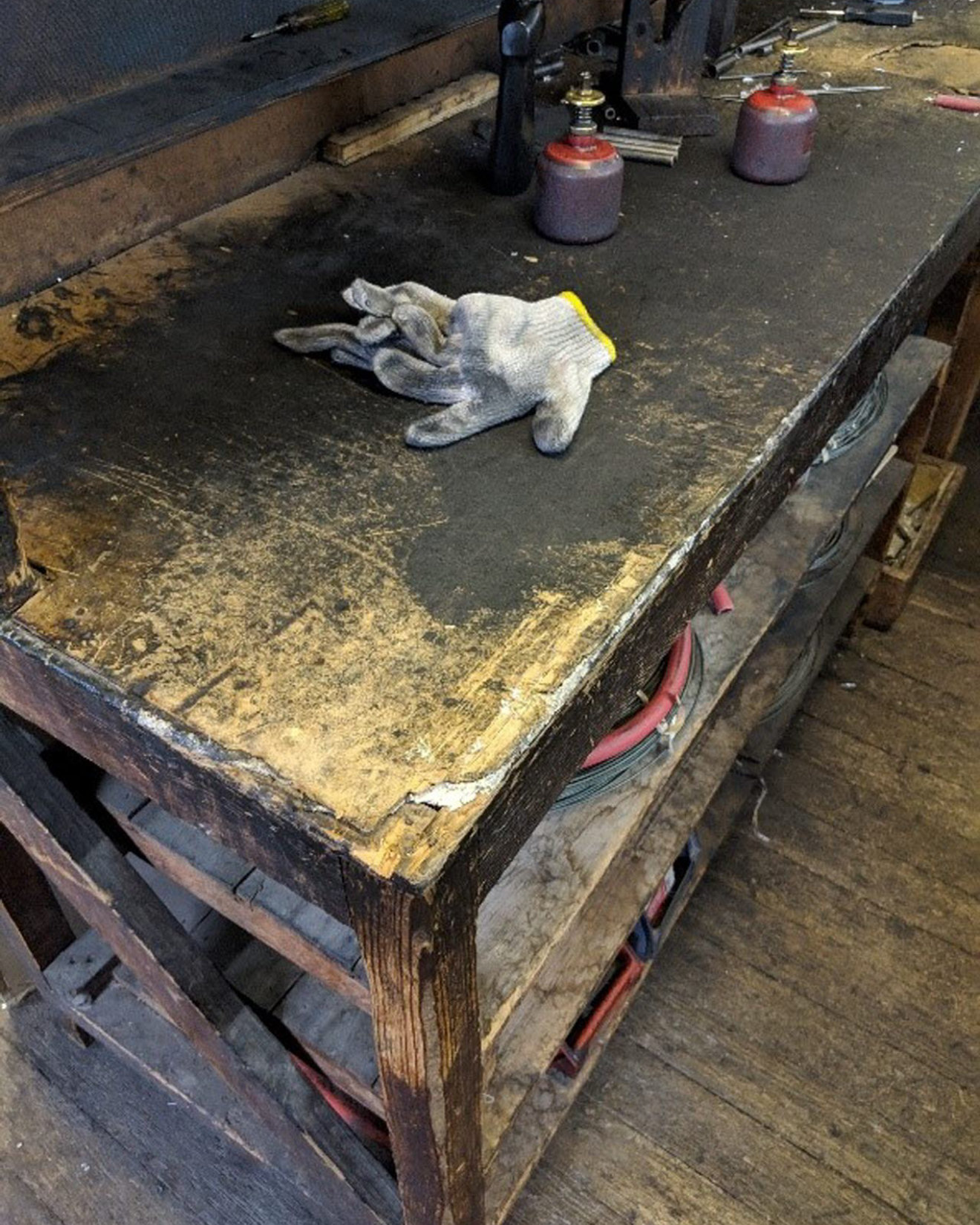 Asbestos insulating board used to fireproof a workbench