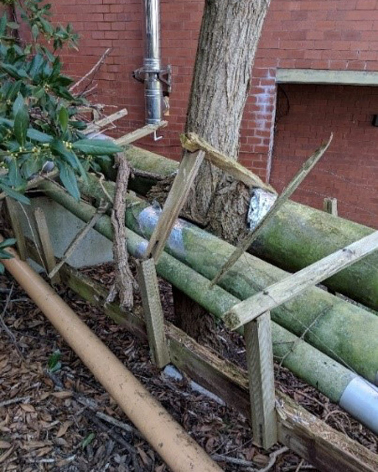 External asbestos insulated pipework with hard set exterior 