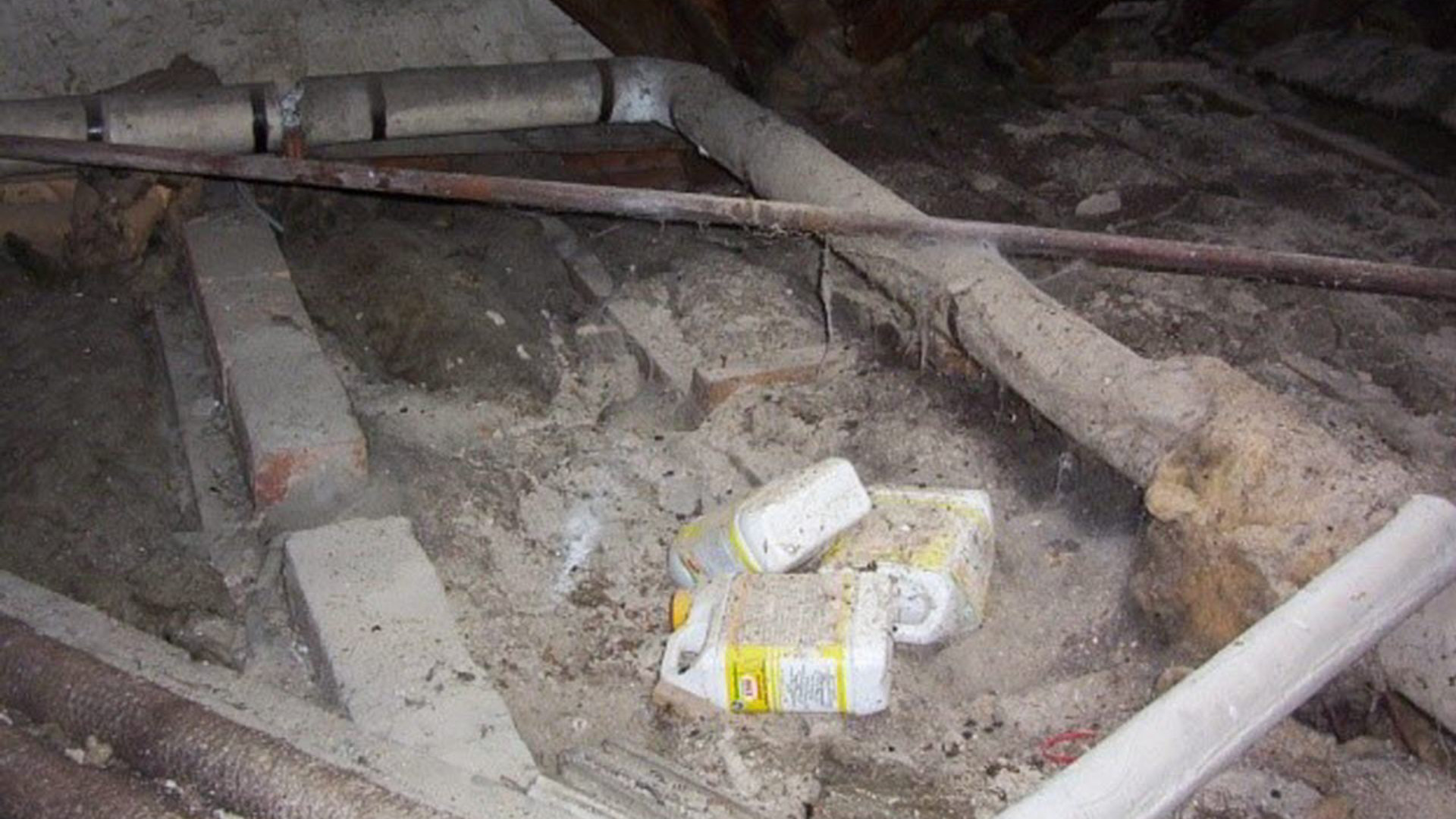 Sectional asbestos insulation in roof space of residential property 