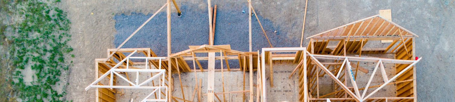 A wooden building framework under construction