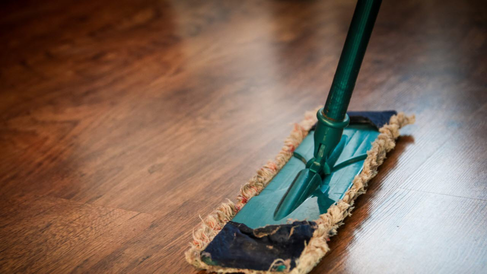 Cleaning a brown wooden floor