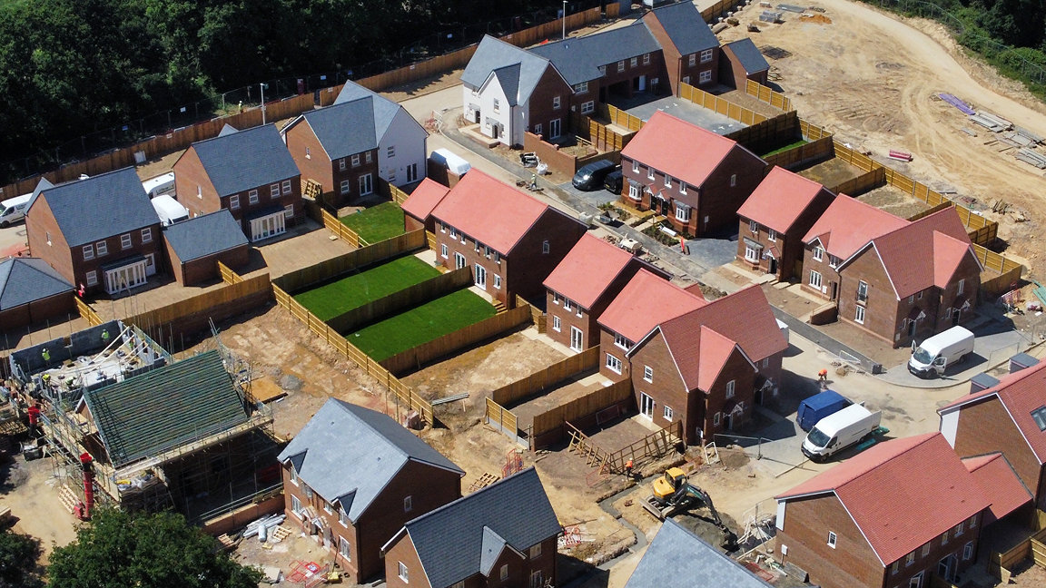 Aerial view of new houses being developed on a construction site in the UK