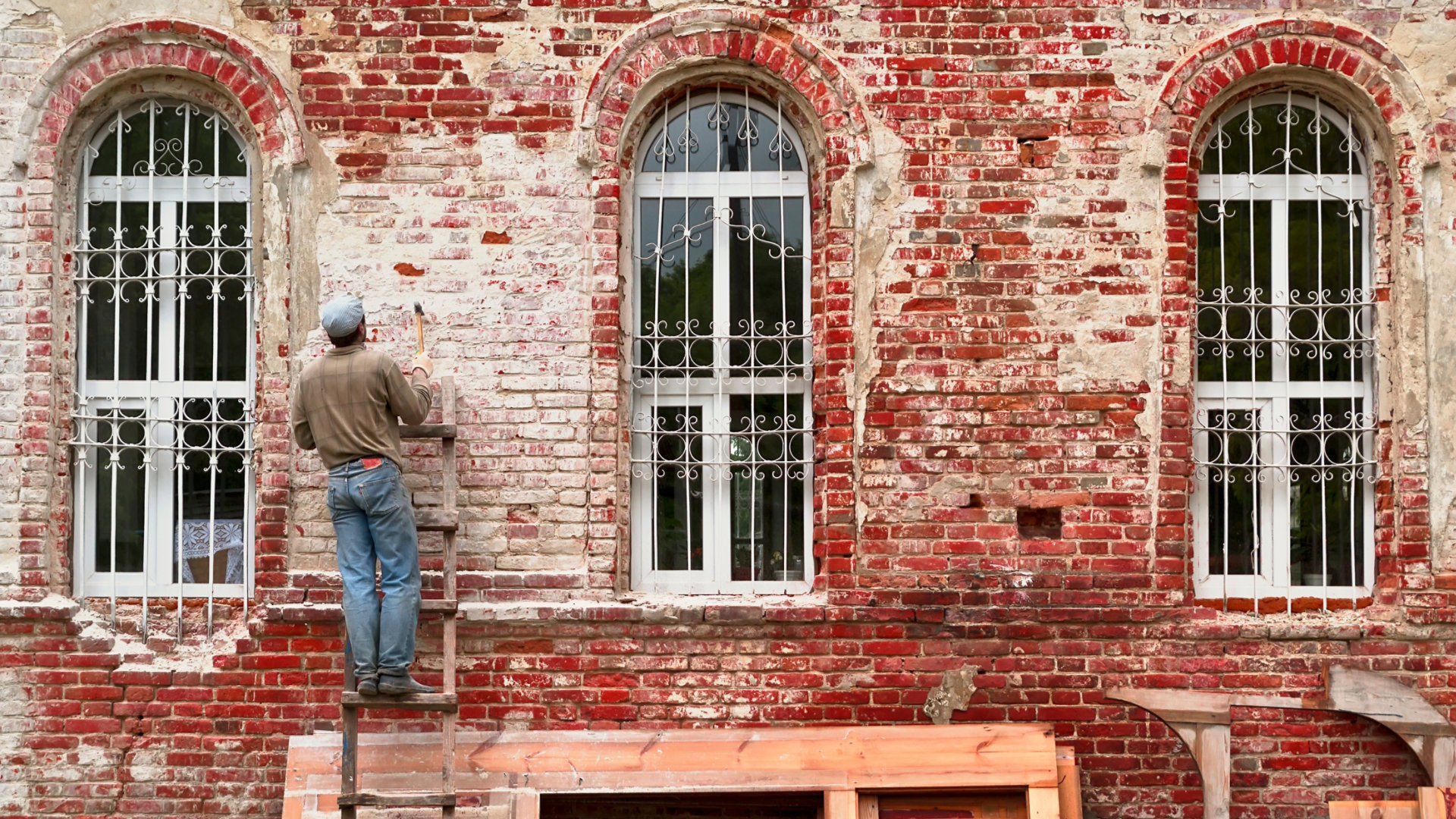 Building wall with worker