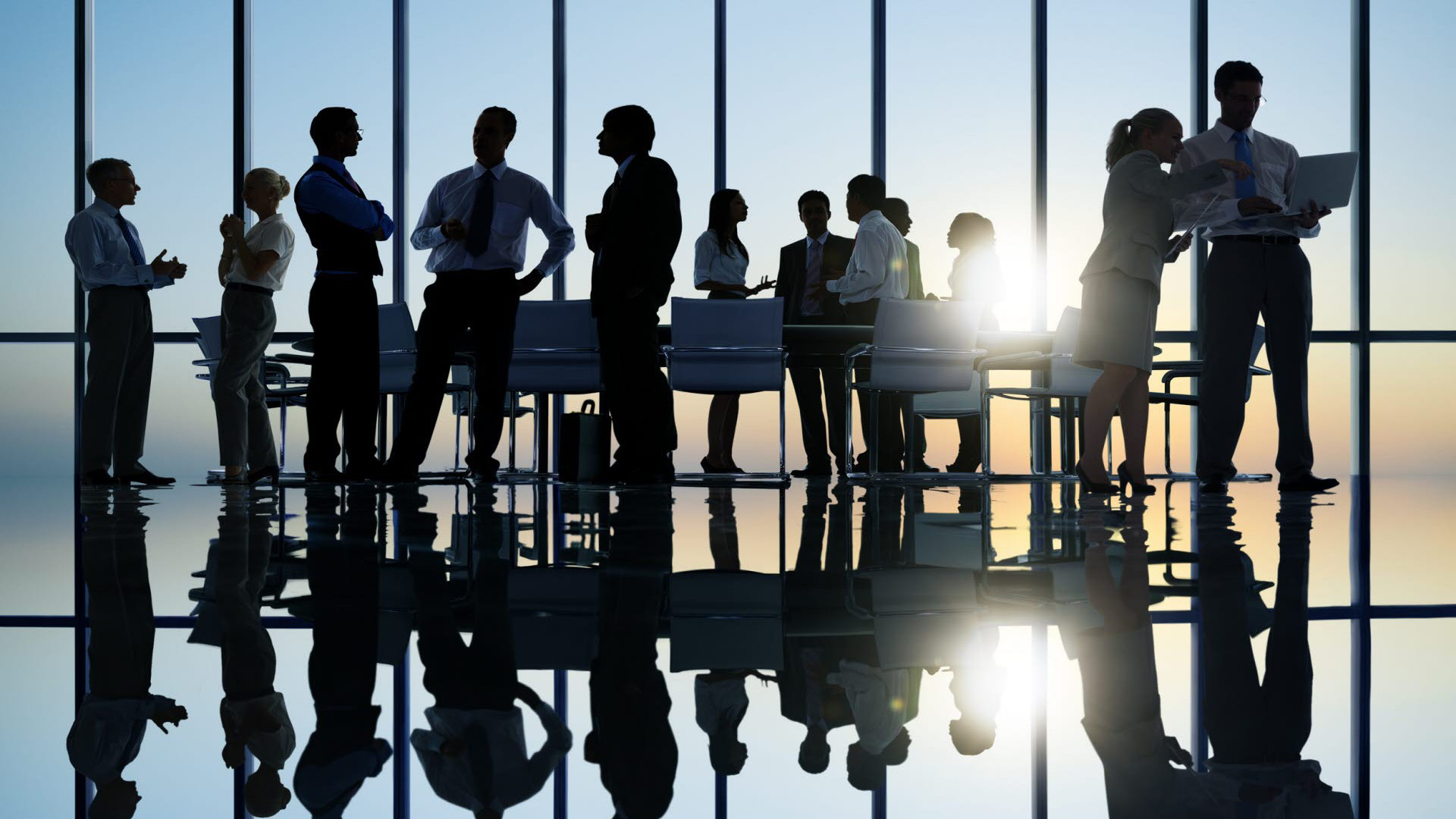 A silhouette of business people holding a meeting 