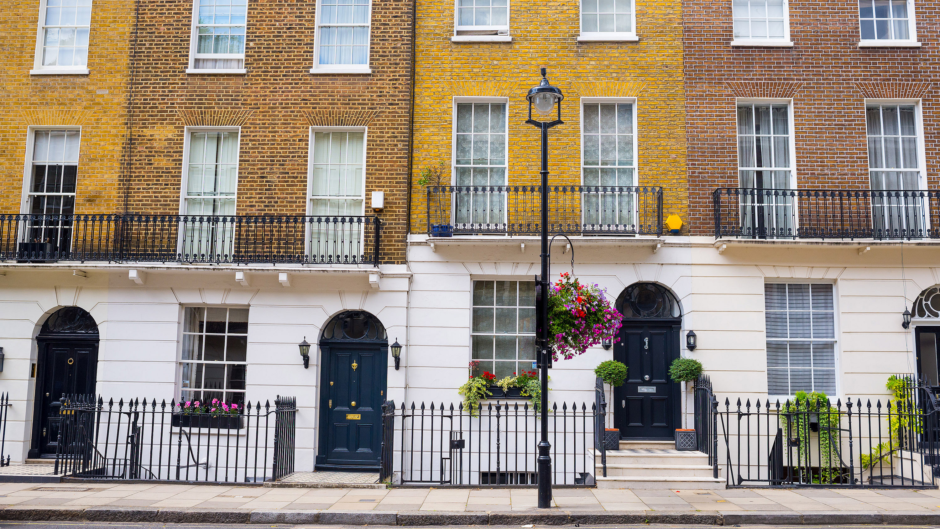 Large Georgian townhouses on a residential street in London