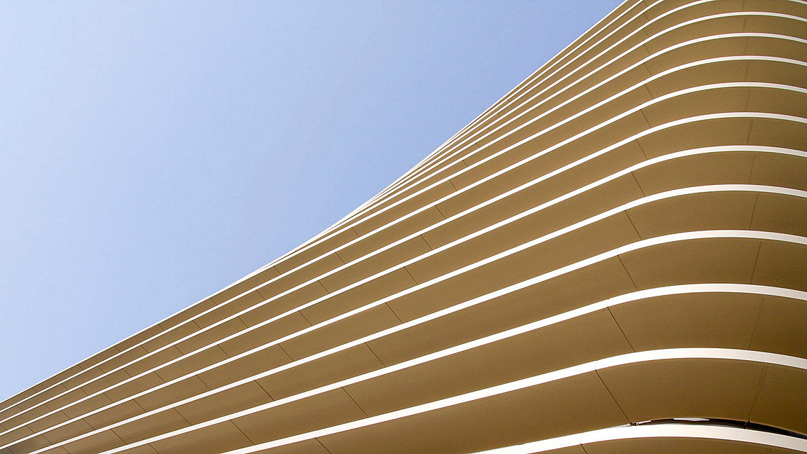 Upward view of a modern building facade in the daylight