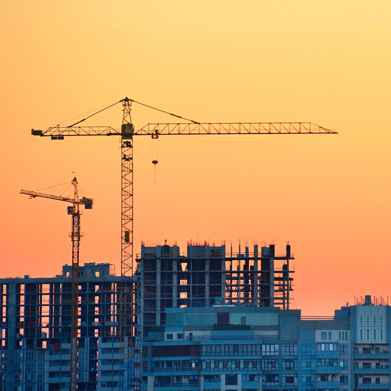 Building under construction with sunset