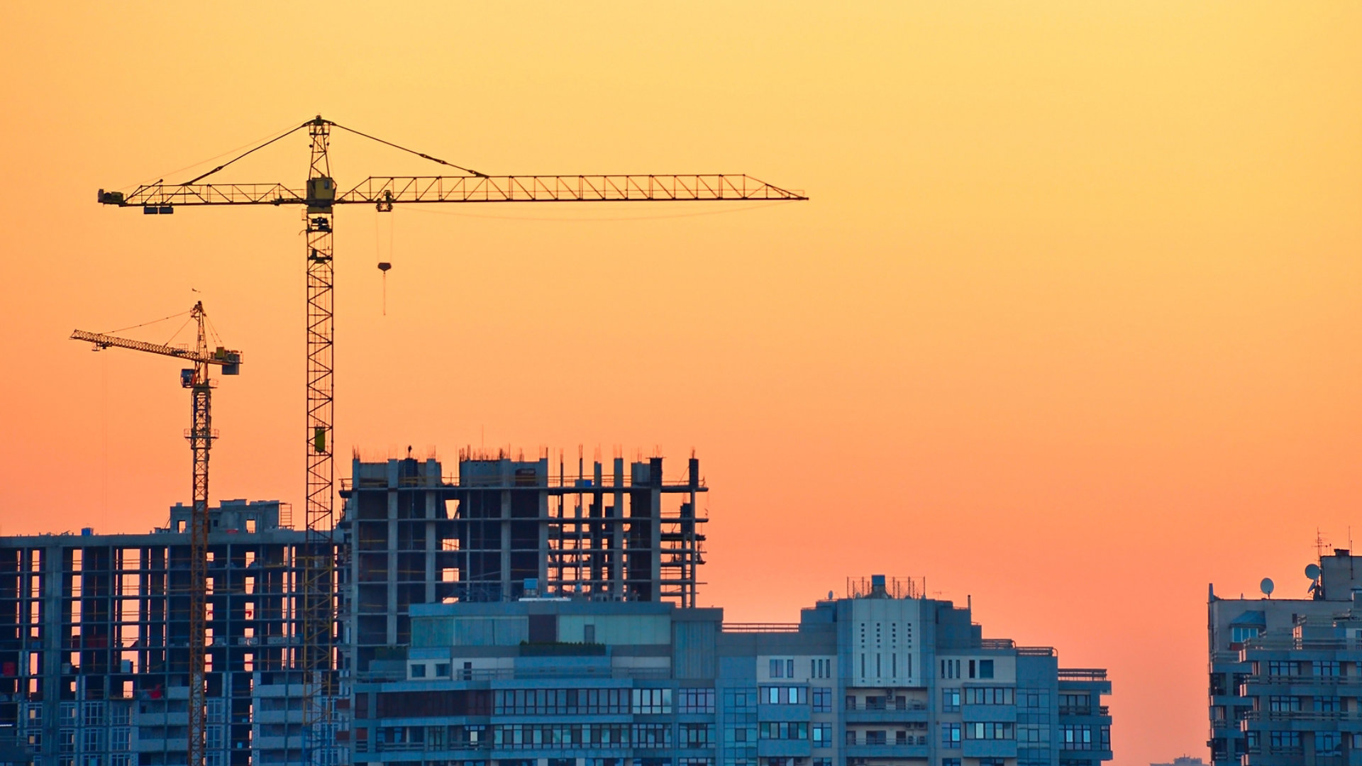 Building under construction with sunset