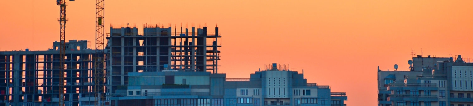 Building under construction with sunset