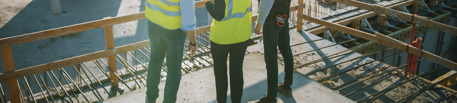 Diverse team of specialists inspecting a construction site