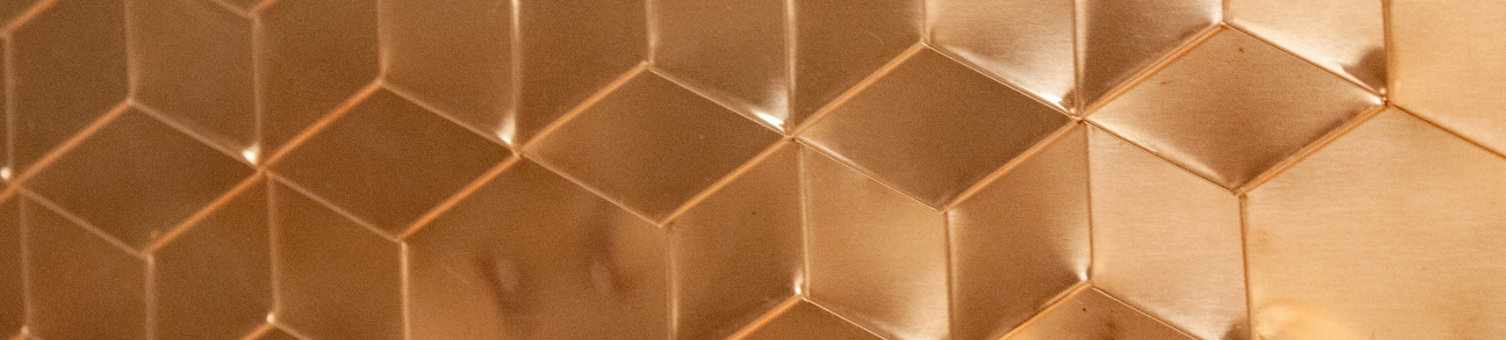 A gold surface with cubic designs