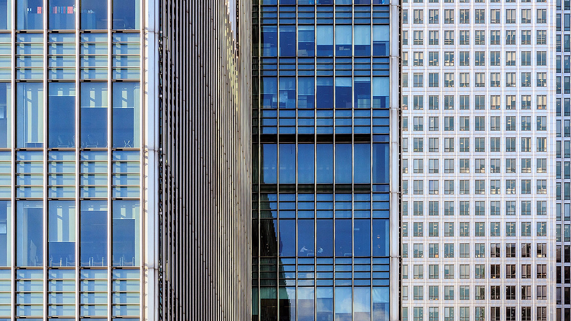 Office windows in Canary Wharf financial district of London