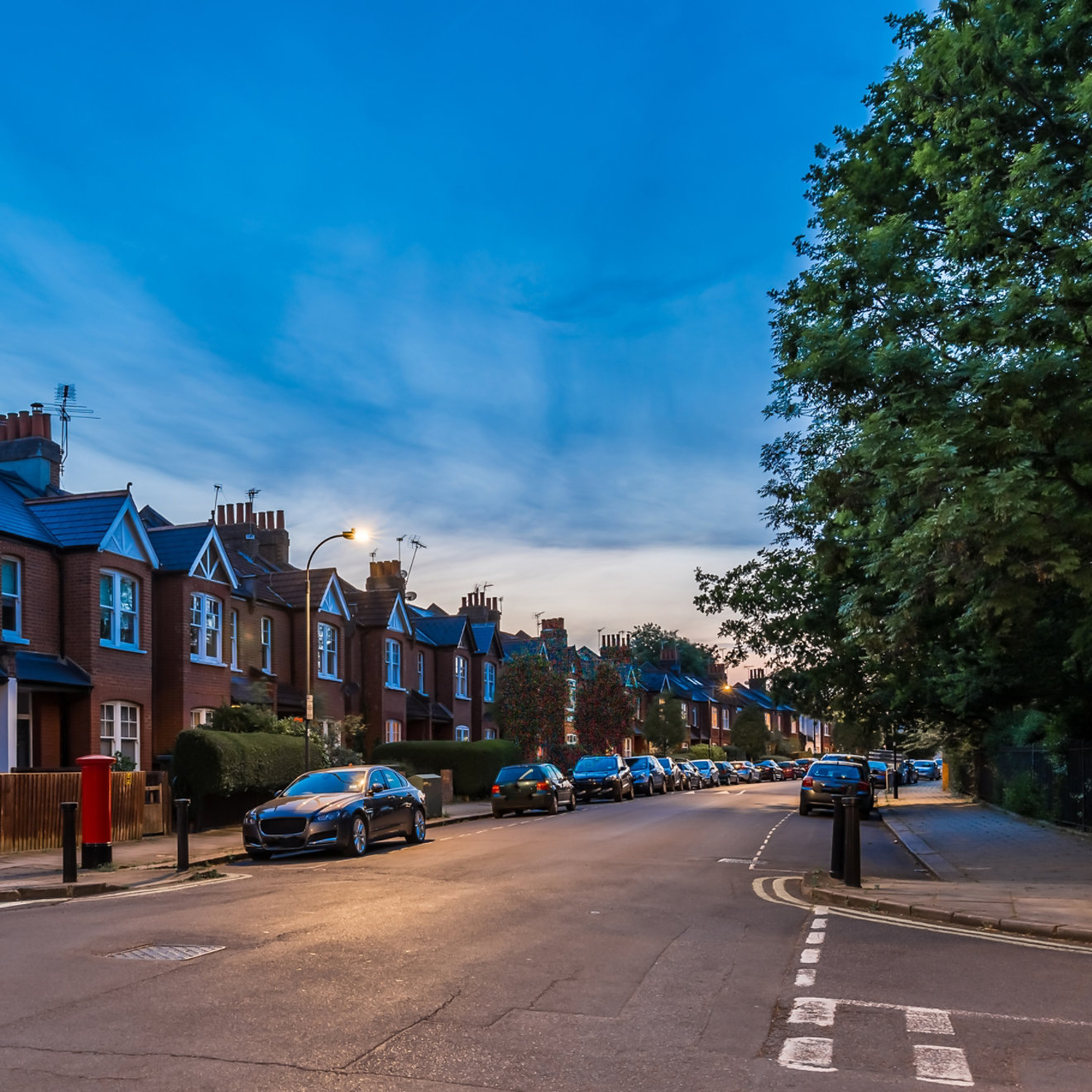 Houses next to a road in the evening