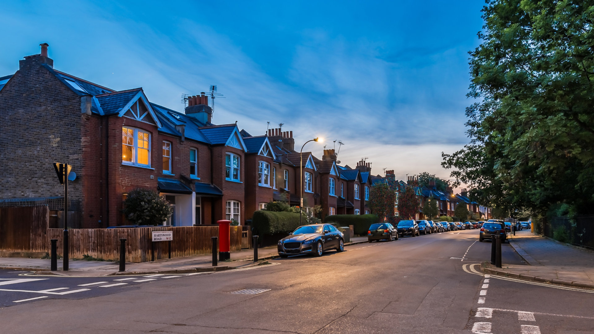 Houses next to a road in the evening