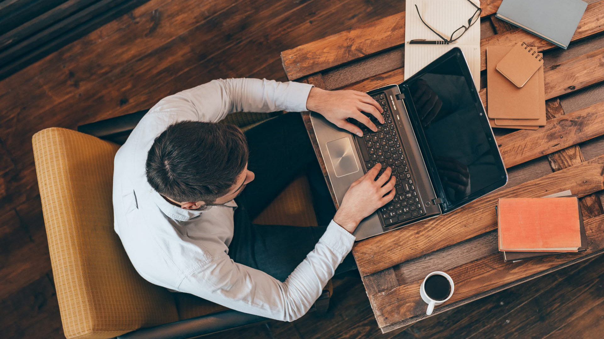 A man behind a laptop