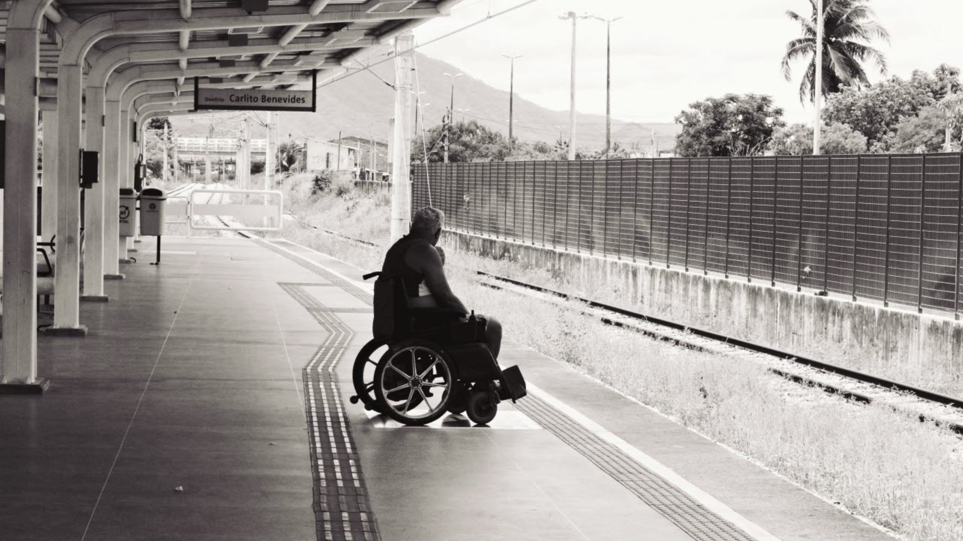 Disable man in wheelchair on a platform