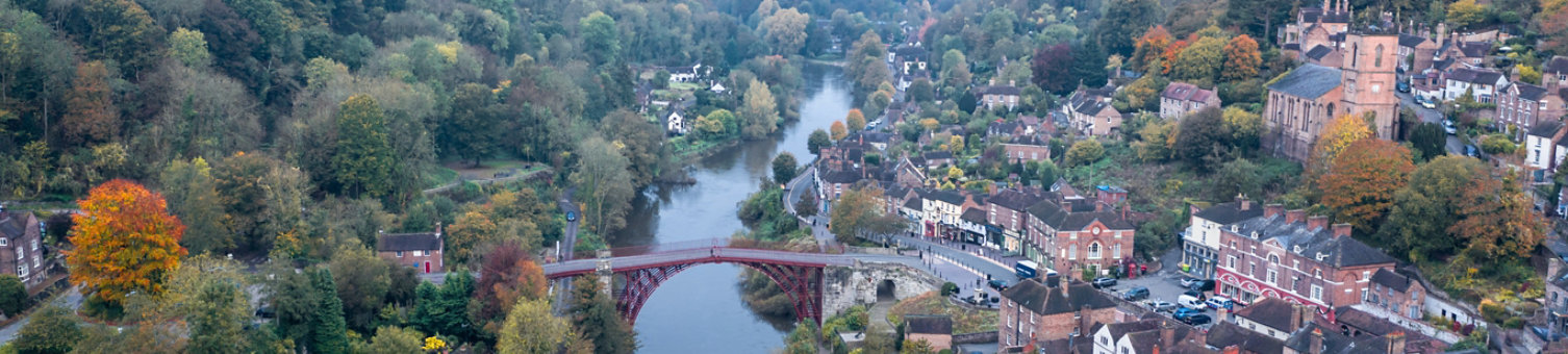 High altitude drone shoot over historic Victorian town at autumn. Ironbridge in Shropshire, UK; Shutterstock ID 1544839514; purchase_order: N/A; job: MEL Event; client: RICS_PP; other: 