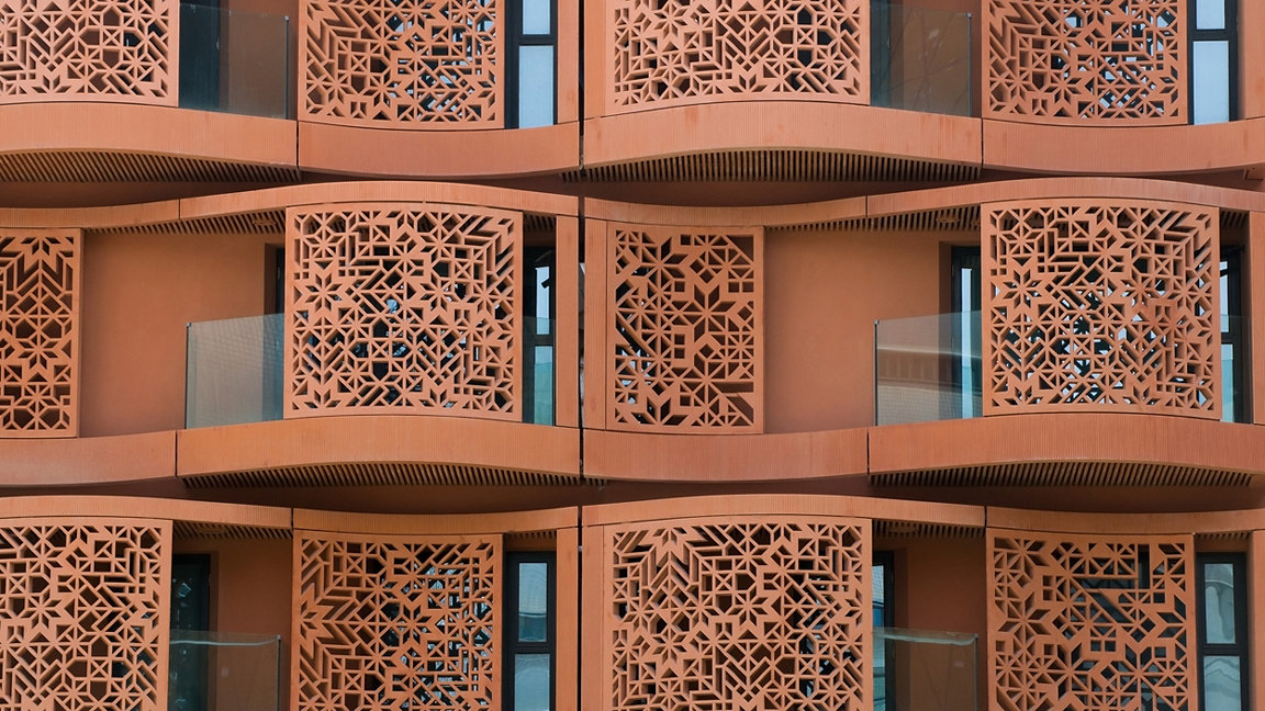 Close-up shot of balconies on an eco-friendly building which uses shadow to prevent direct sunlight from entering
