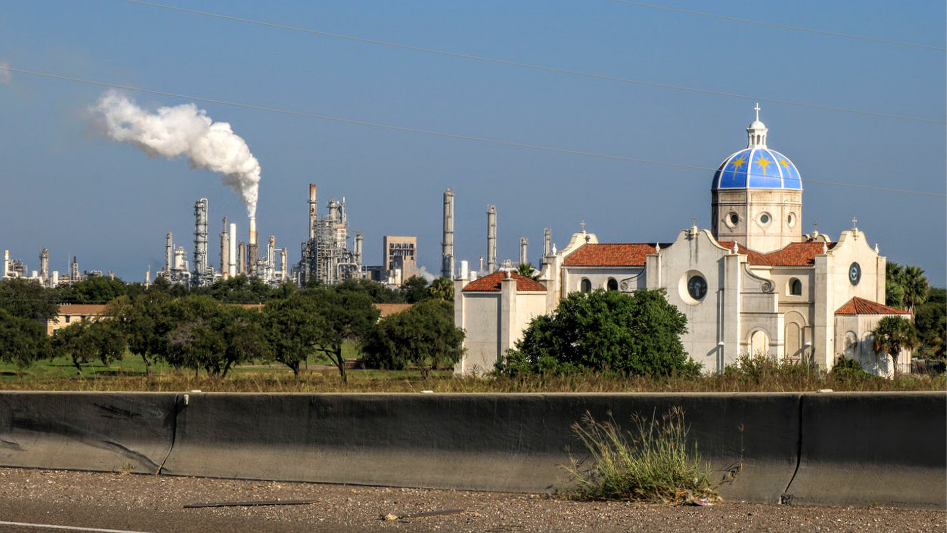 Valero’s West Refinery is seen behind Our Lady of Corpus Christi chapel along Interstate 37 in September 2022. 