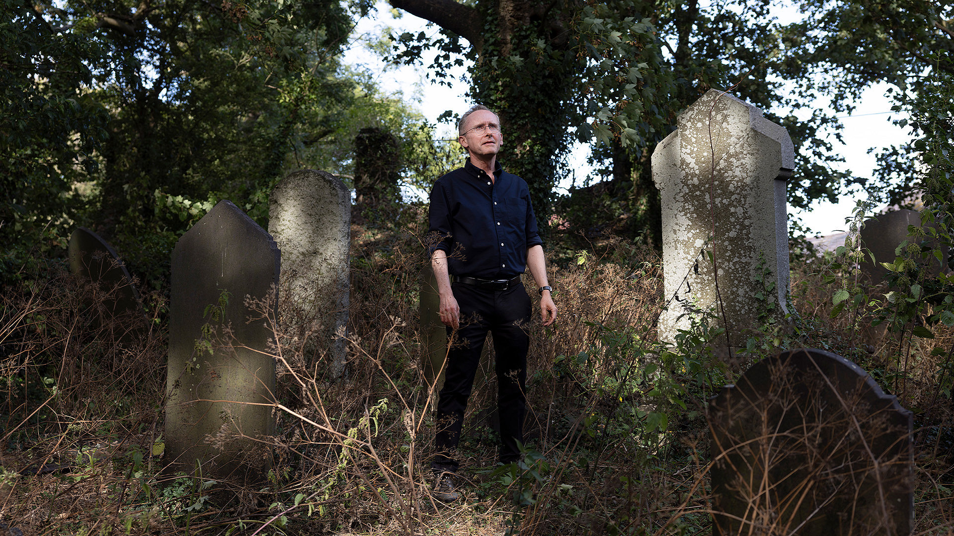 David Farrington MRICS in a church graveyard