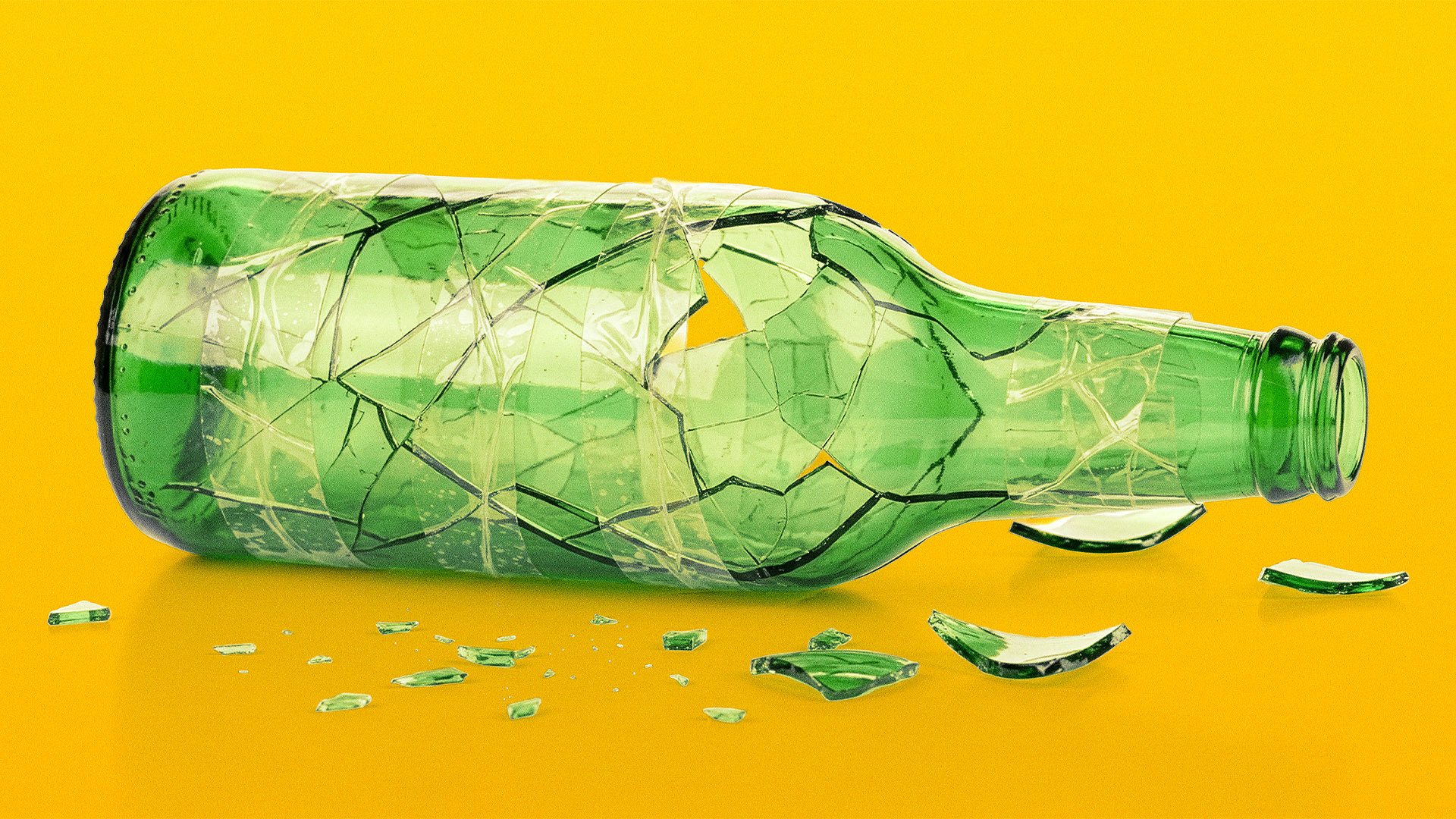 A broken beer bottle taped together