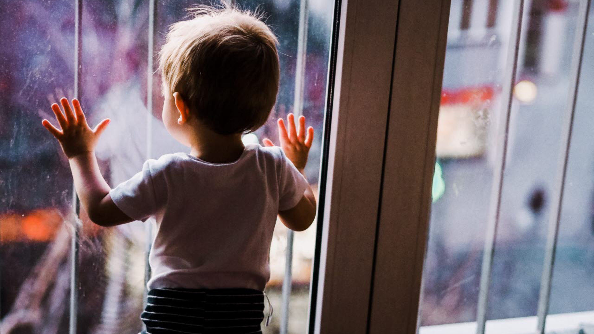 Child looking out of window