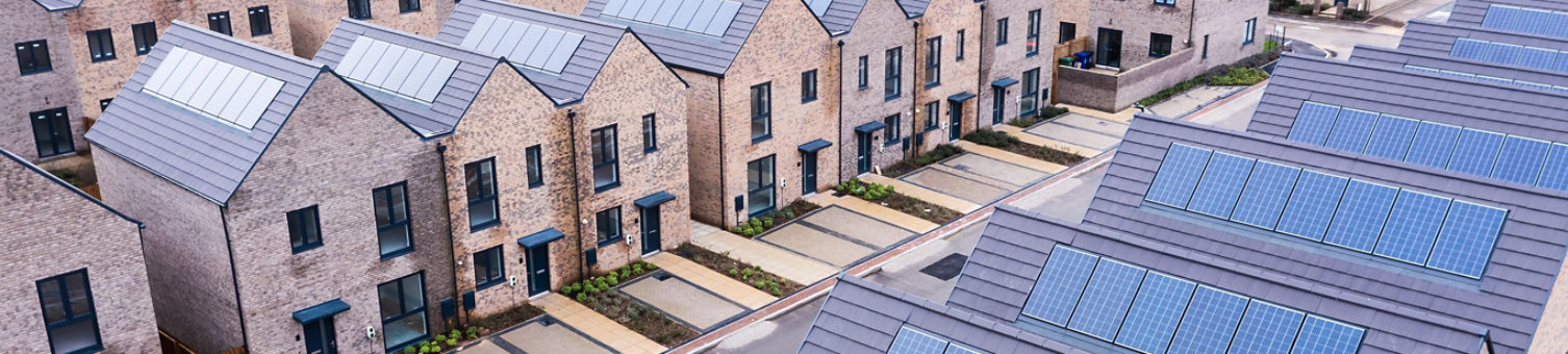 Aerial view of rows of new build modular terraced houses in the UK