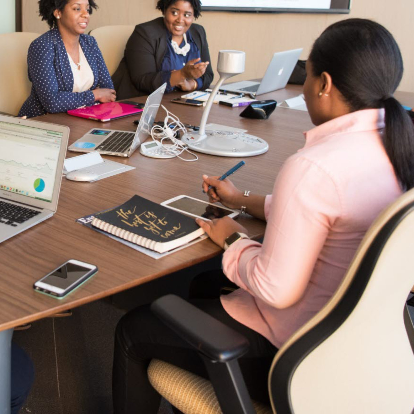 people-sitting-beside-brown-wooden-desk-near-flat