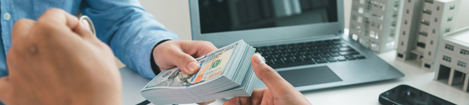 Real estate brokers are bribing government officials with cash issue construction permits in areas where high rise buildings are prohibited. Concept bribing government officials to facilitate business