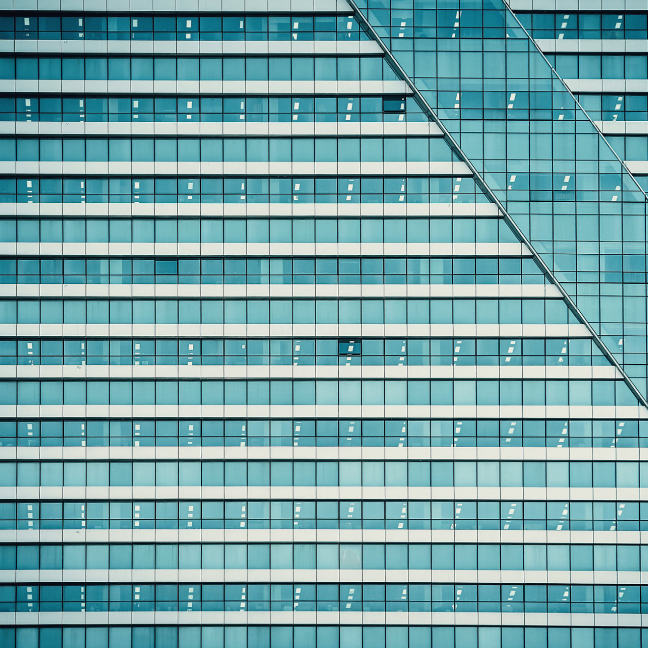 A blue tile pattern on the exterior of a building