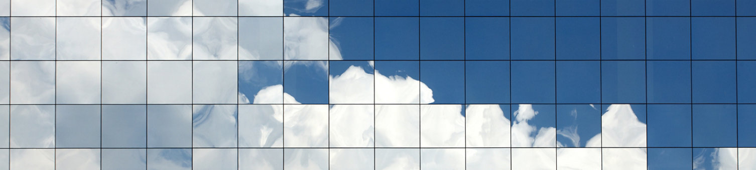 Clouds reflected in windows of modern office building; Shutterstock ID 122673427; purchase_order: -; job: -; client: -; other: -