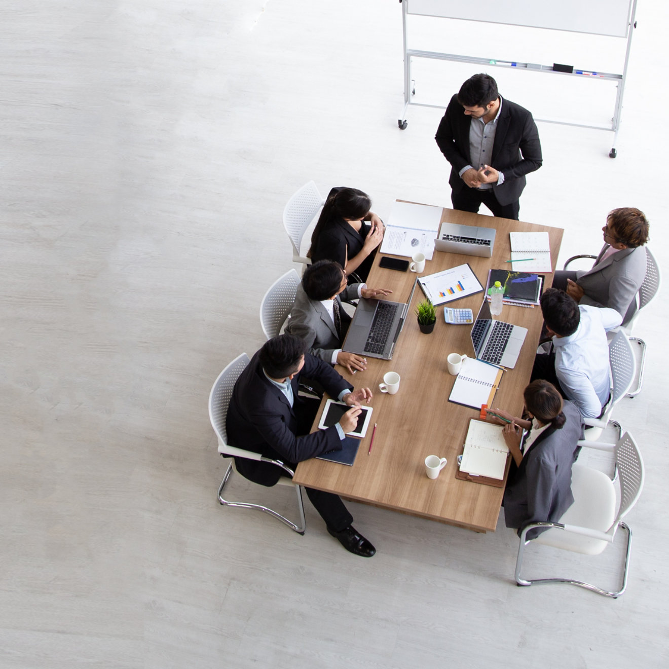 A birds eye view of a meeting taking place amongst colleagues