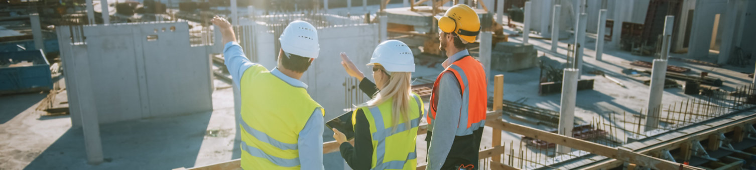 Diverse team of specialists inspecting a construction site